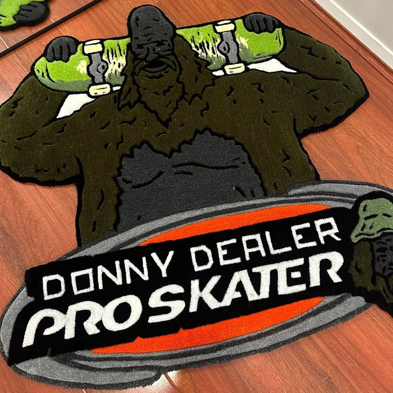 Handmade tufted rug of a gorilla holding a skateboard, text reads 'Donny Dealer Proskater'.