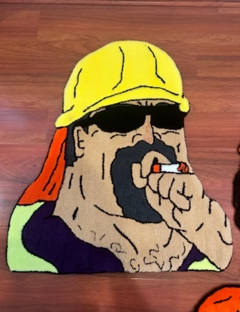 Handmade tufted rug featuring cartoon builder in yellow hard hat and sunglasses, on wood floor