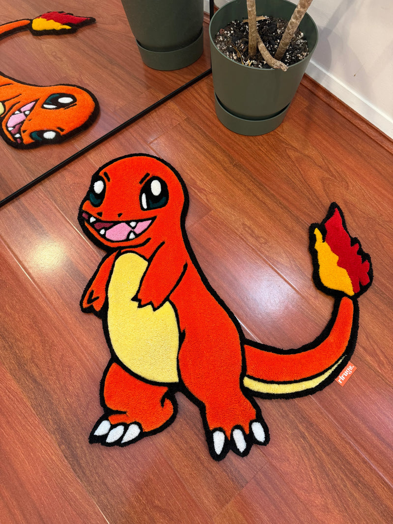 Handmade tufted rug featuring an orange cartoon dragon on wood floor near a plant pot